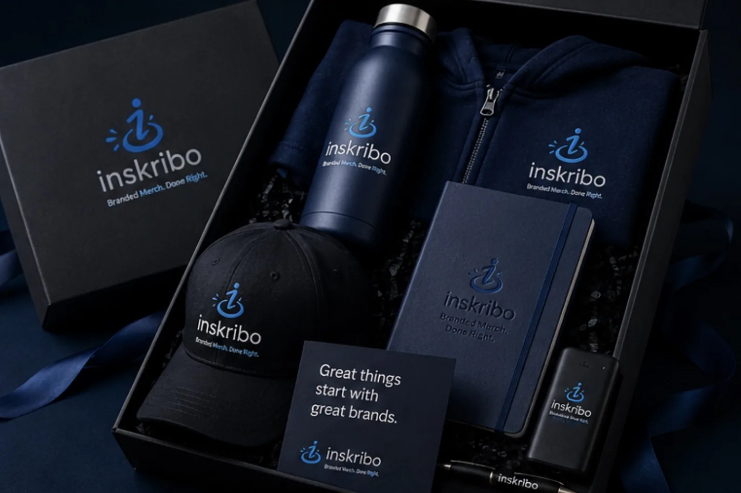 Premium Inskribo branded gift box with drinkware, apparel, and notebook