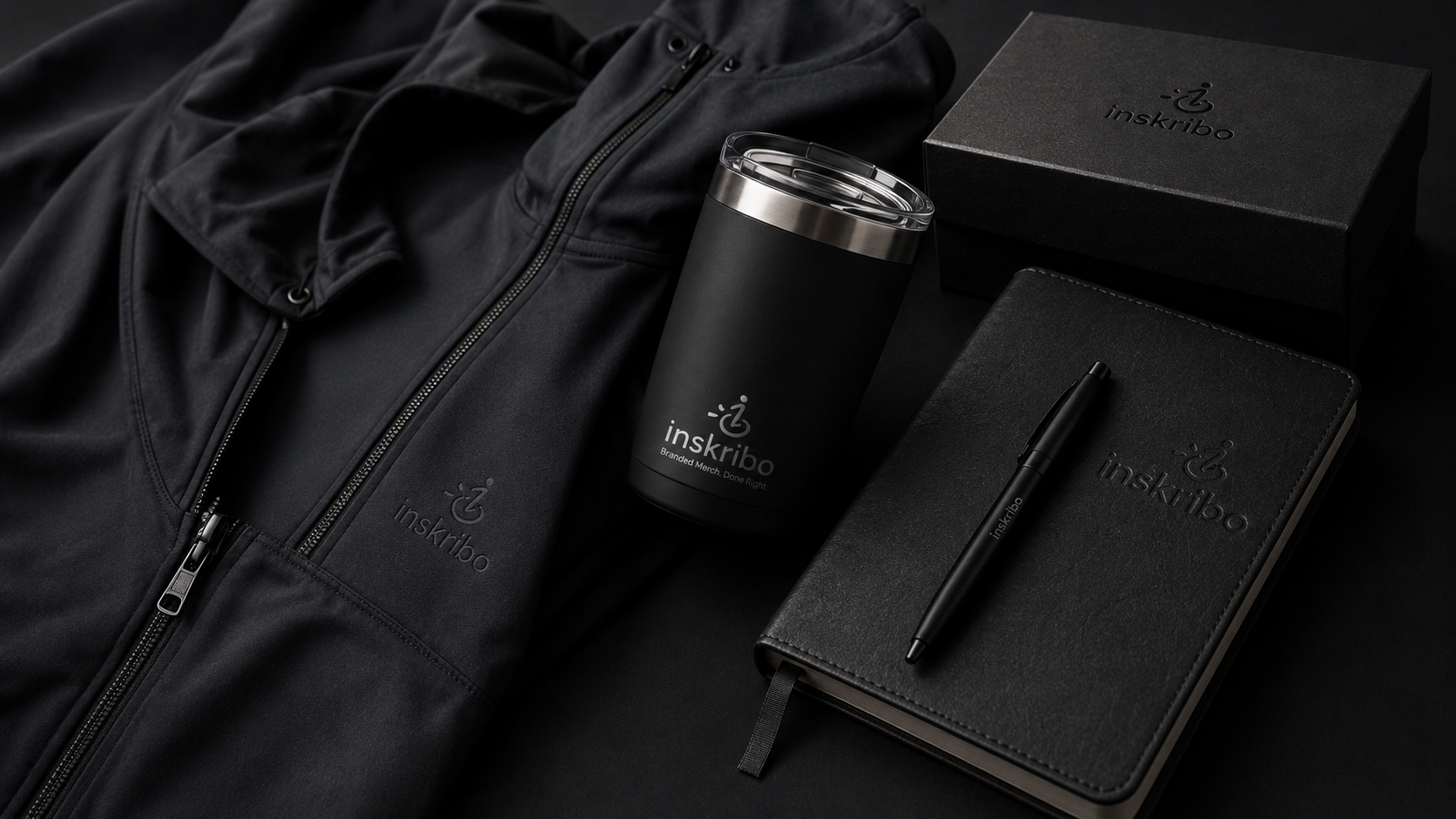 A premium branded merch welcome kit laid out